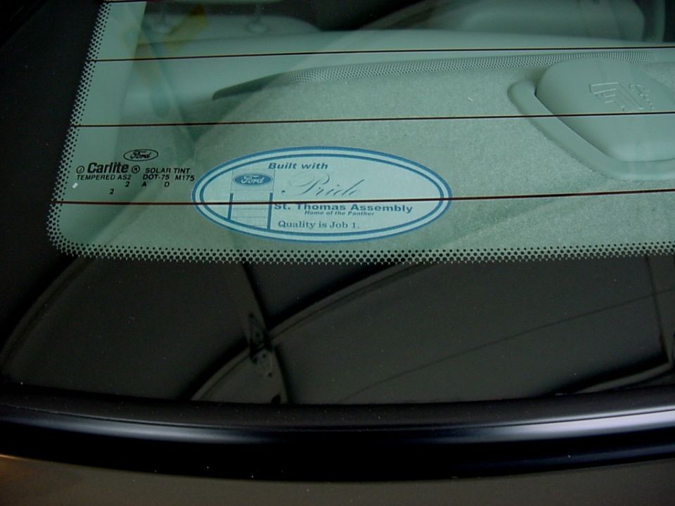 St. Thomas Assembly 'Built with Pride' Ford sticker on the rear parcel shelf, seen through the back glass