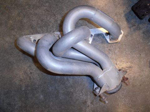 1990 Ford Bronco - An exhaust manifold is shown, a crucial part of a vehicle's engine system.