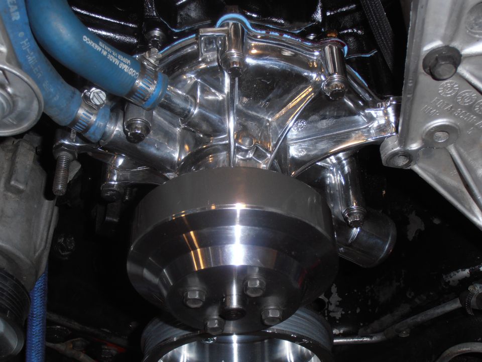 Chrome water pump and pulley assembly with blue hose