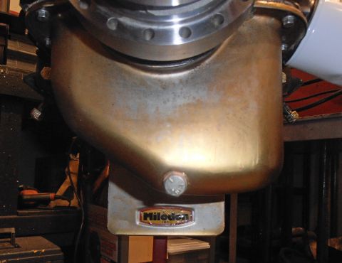 1990 Ford Bronco - A close-up view of an engine oil pan, identified by a Milodon Inc. sticker.