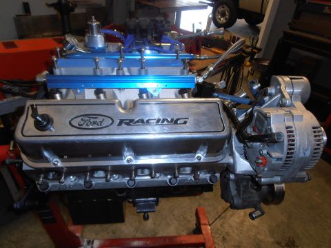 1990 Ford Bronco - Close-up of a Ford Racing engine component, likely a valve cover and associated parts.