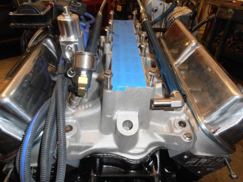 1990 Ford Bronco - Engine components, including the intake manifold and valve covers, are shown in this close-up view.