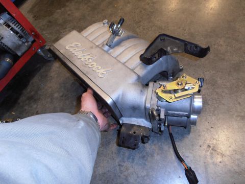 1990 Ford Bronco - Edelbrock intake manifold with throttle body assembly and wiring harness.