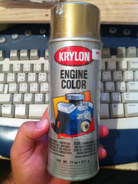 2001 Mercury Grand Marquis - A can of Krylon Engine Color spray paint is held in front of a computer keyboard.