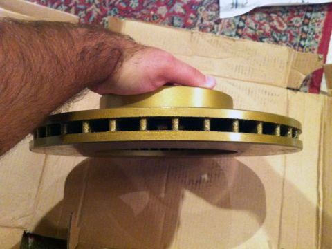 2001 Mercury Grand Marquis - A gold-colored brake rotor is shown, likely for front brake work.