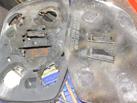 1983 Ford Bronco - After grinding away the backing plate on each point of attachment, the glass comes away intact.