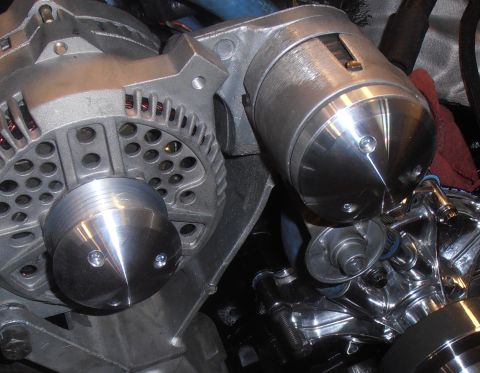 1990 Ford Bronco - Engine components including an alternator and a custom pulley system are visible in this close-up shot.