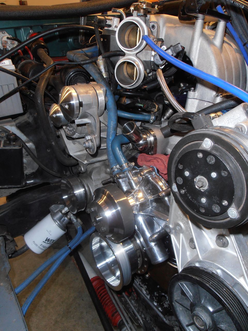Engine pulleys and hoses, with a WIX filter visible