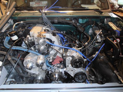 1990 Ford Bronco - Custom engine bay modifications a dual throttle body intake system and updated components.
