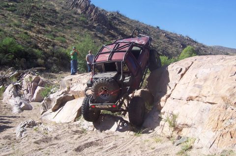 1981 Ford F-150 - Custom off-road buggy navigates a challenging rocky terrain.