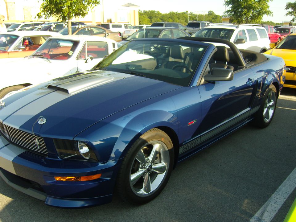 Blue 2007 Ford Mustang Shelby GT convertible with silver racing stripes