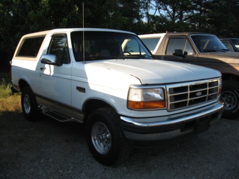 1978 Ford Bronco - A white Ford Bronco is parked outdoors, with another Bronco visible behind it.