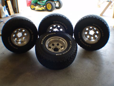 1996 Ford Bronco - Set of four tires and wheels, including BFGoodrich All-Terrain T/A and Uniroyal brands.