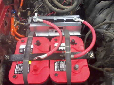 1995 Ford F-150 - A dual battery setup with red Optima batteries and a silver isolator is visible in the engine bay.
