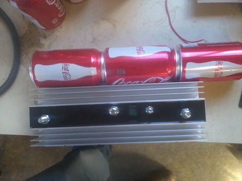 1995 Ford F-150 - A dual battery tray with isolator is shown next to three cans of Coca-Cola.