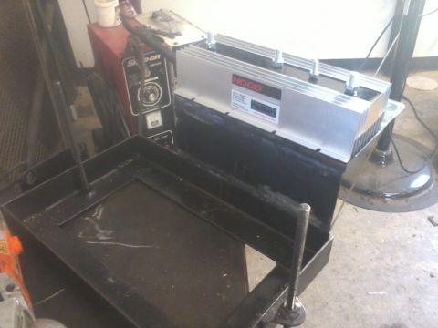 1995 Ford F-150 - A dual battery tray and a NOCO battery isolator are shown in a workshop setting.