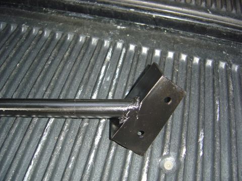 1986 Ford Bronco - A close-up view of a steering box bracket, likely a replacement part for a vehicle.