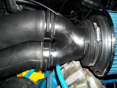 1989 Ford Bronco - Cold air intake tube and blue air filter assembly.
