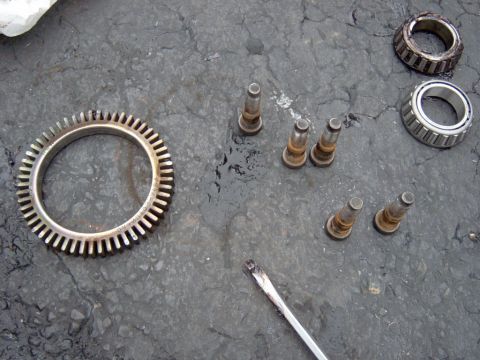 1995 Ford Bronco - The ABS ring, studs and an old bearing next to a new one.