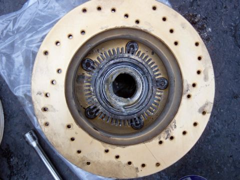 1995 Ford Bronco - Pound the studs back in and put the new bearings in, along with the grease seal, or a new one if you need it.