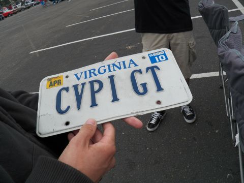 2003 Ford Crown Victoria - Virginia vanity plate CVPI GT held up, April 10 registration sticker, sneakers and lot visible below
