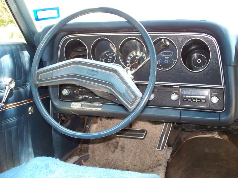 1976 Ford Torino - Interior view of a 1976 Ford Torino, highlighting the dashboard instrumentation and center console.