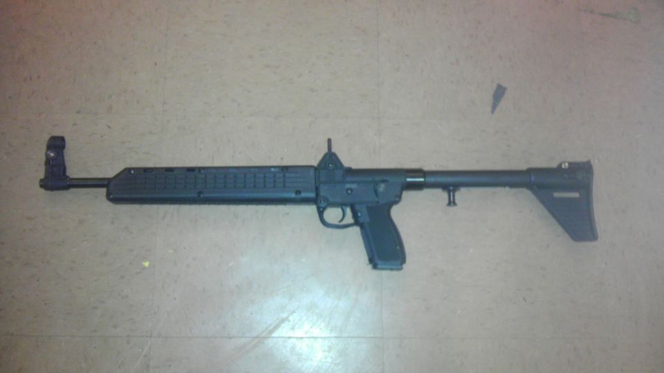 Black semi-automatic rifle with adjustable stock and pistol grip