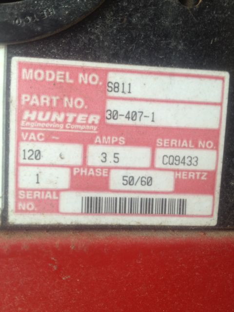 2000 Jeep Wrangler - Close-up of a Hunter Engineering Company data plate showing electrical specifications and serial number.