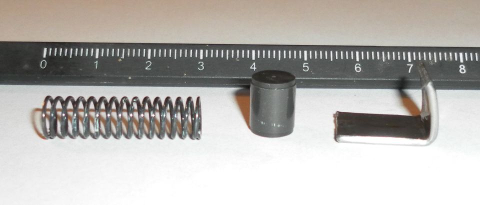 Spring, cylinder, and bracket with ruler markings