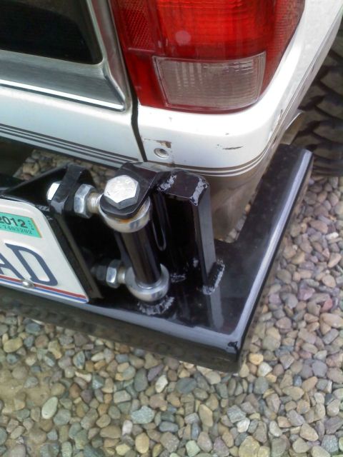 1996 Ford Bronco - Custom trailer hitch assembly on a white SUV, a 2012 license plate.