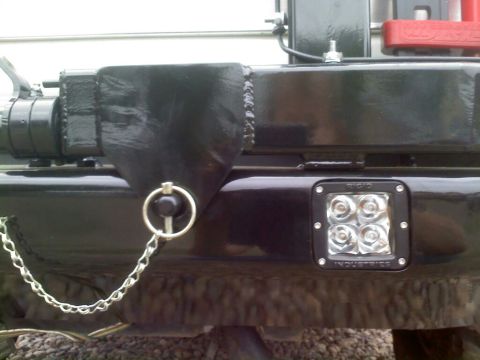 1996 Ford Bronco - Close-up of aftermarket bumper modifications, including a tow hitch and auxiliary lighting.