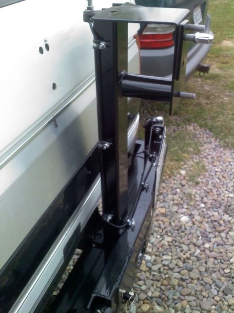 1996 Ford Bronco - The rear of a 1996 Ford Bronco shows a custom spare tire carrier mounted to the bumper.