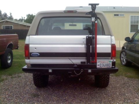 1996 Ford Bronco - Rear view of a 1996 Ford Bronco equipped with a Hi-Lift jack and aftermarket bumper.