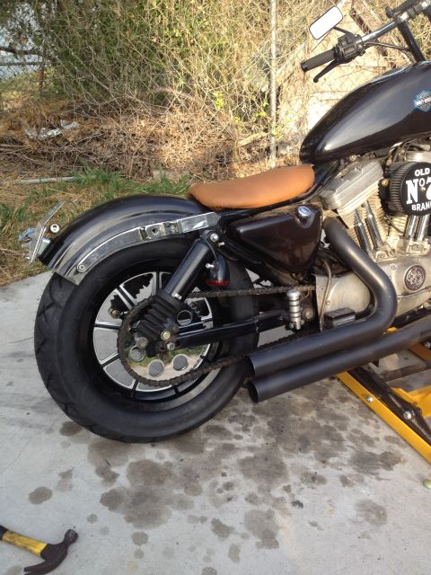 1995 Ford Bronco - This motorcycle has a custom look with a brown seat and blacked-out pipes.