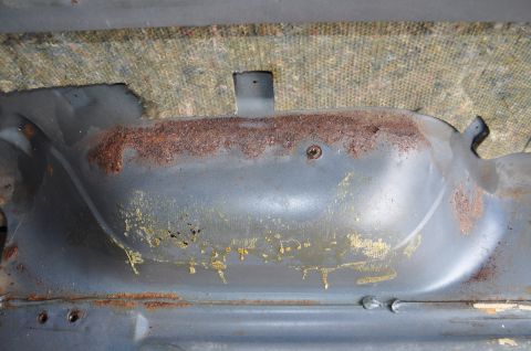 1986 Ford Bronco - Interior metal panel shows significant rust and wear, indicating potential structural issues.