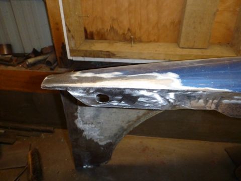 1969 MINI Cooper - Car fender repair in progress, with visible metalwork and primer applied.