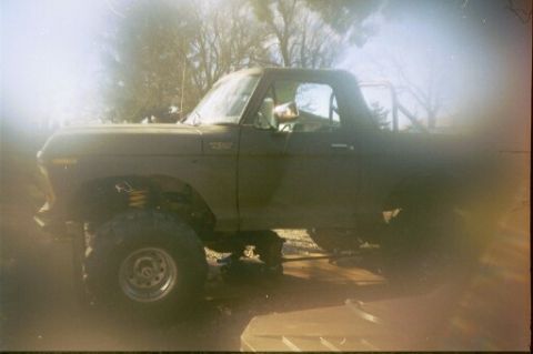 1979 Ford Bronco - Lifted 1978 Ford Bronco shown from the side, aftermarket suspension and wheels.