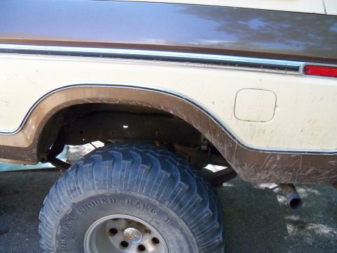 1979 Ford Bronco - The rear tire and wheel well of a classic Ford Bronco, showing its off-road capabilities.