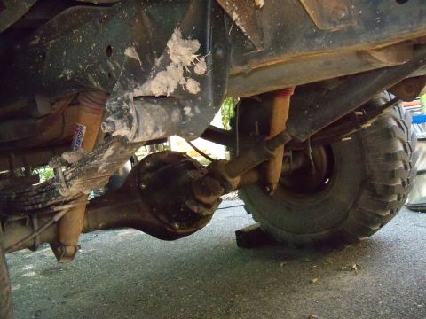1979 Ford Bronco - Undercarriage view of a 1978 Ford Bronco, showing the rear axle and suspension components.