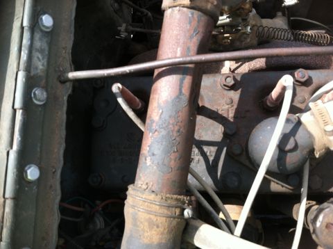 1986 Ford Bronco - Close-up view of engine components with visible rust and wiring.