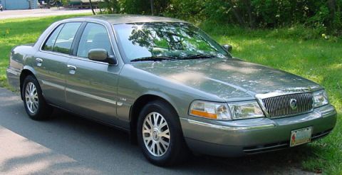 2003 Mercury Grand Marquis - The color is called Spruce Green Metallic Clearkote. This view shows the new front end styling. The LSE letters are visible on the front fe…