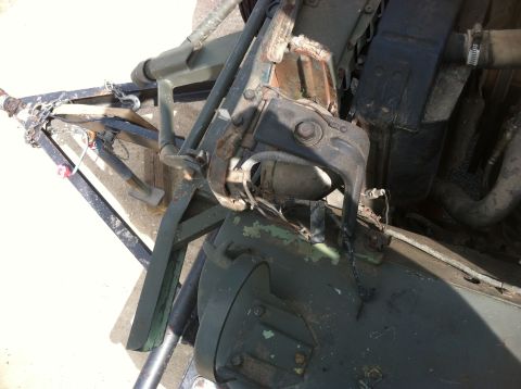 1986 Ford Bronco - The photo shows a close-up view of a vehicle's engine components and a trailer hitch mechanism.