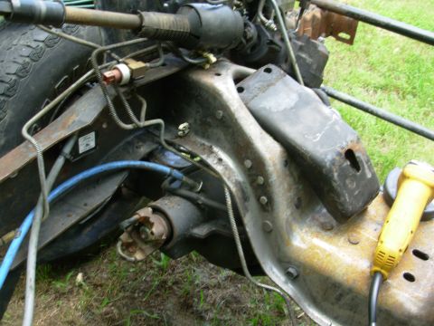 1983 Ford Bronco - Both perches are bolted, but this one also has 4 rivets that I've ground the heads off. The (faded) red switch on the frame rail is the '93…