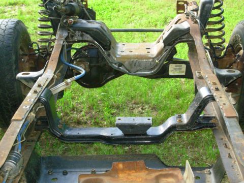 1983 Ford Bronco - Test-fitting a '90 M5OD-R2 4WD crossmember; it fits perfectly in the front location.