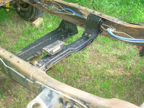 1983 Ford Bronco - Test-fitting a '90 M5OD-R2 4WD crossmember; it fits perfectly in the front location.