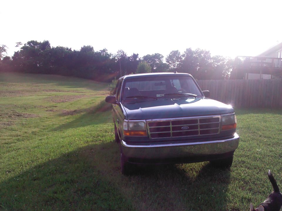 Green 1996 Ford Bronco front view parked on grass