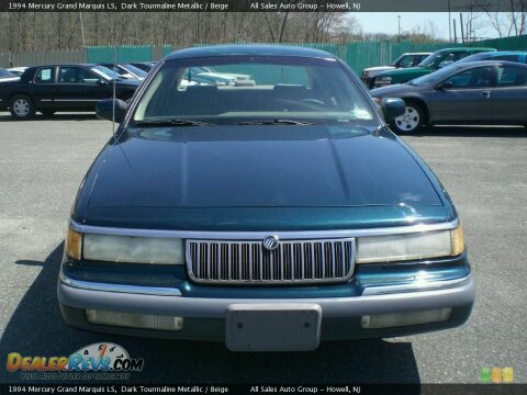 1994 Mercury Grand Marquis - A 1994 Mercury Grand Marquis is shown from the front, parked in a lot with other vehicles.
