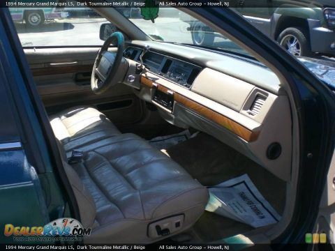 1994 Mercury Grand Marquis - The interior of a 1994 Mercury Grand Marquis, leather seats and wood trim on the dashboard.