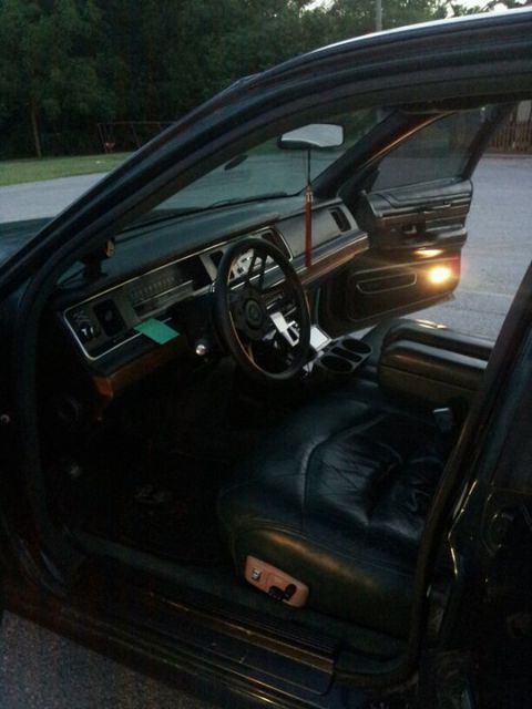 1994 Mercury Grand Marquis - interior completely changed. black panels with dark green seats. much better.