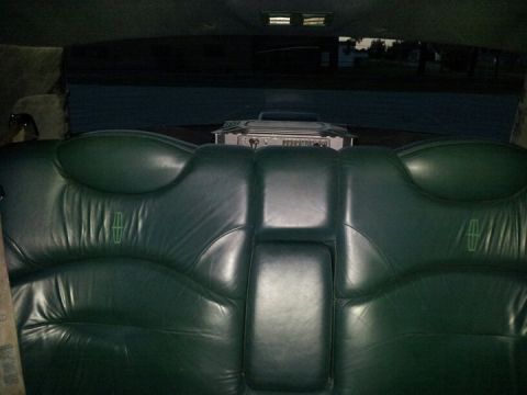 1994 Mercury Grand Marquis - rear window mounted 1000 watt amp for the subs